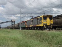 Empty coal train passing by Yarrabee coal loading station.