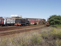 FreeGold loco and other rolling stock next to the coal stage bridge.