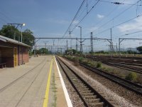 Standing on the Capital Park station platform.