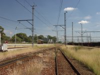 Walking up toward electric loco depot and looking back at Captial Park station.