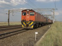 7E3-7232 leading a coal train going up the line.