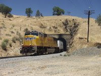 UPRR Swift Roadrailer train emerging from tunnel #10.